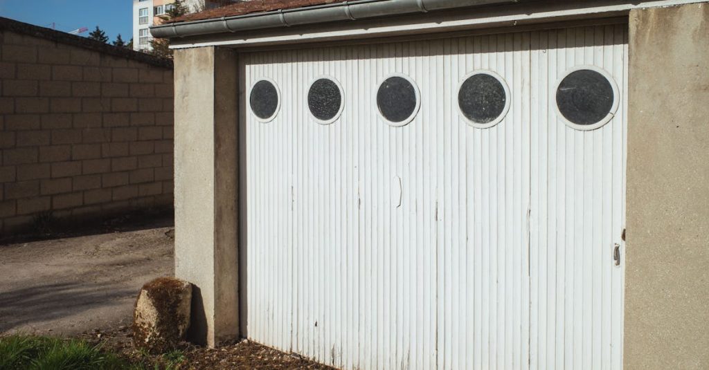 White garage door with circular windows in a residential area of Compiègne, France.